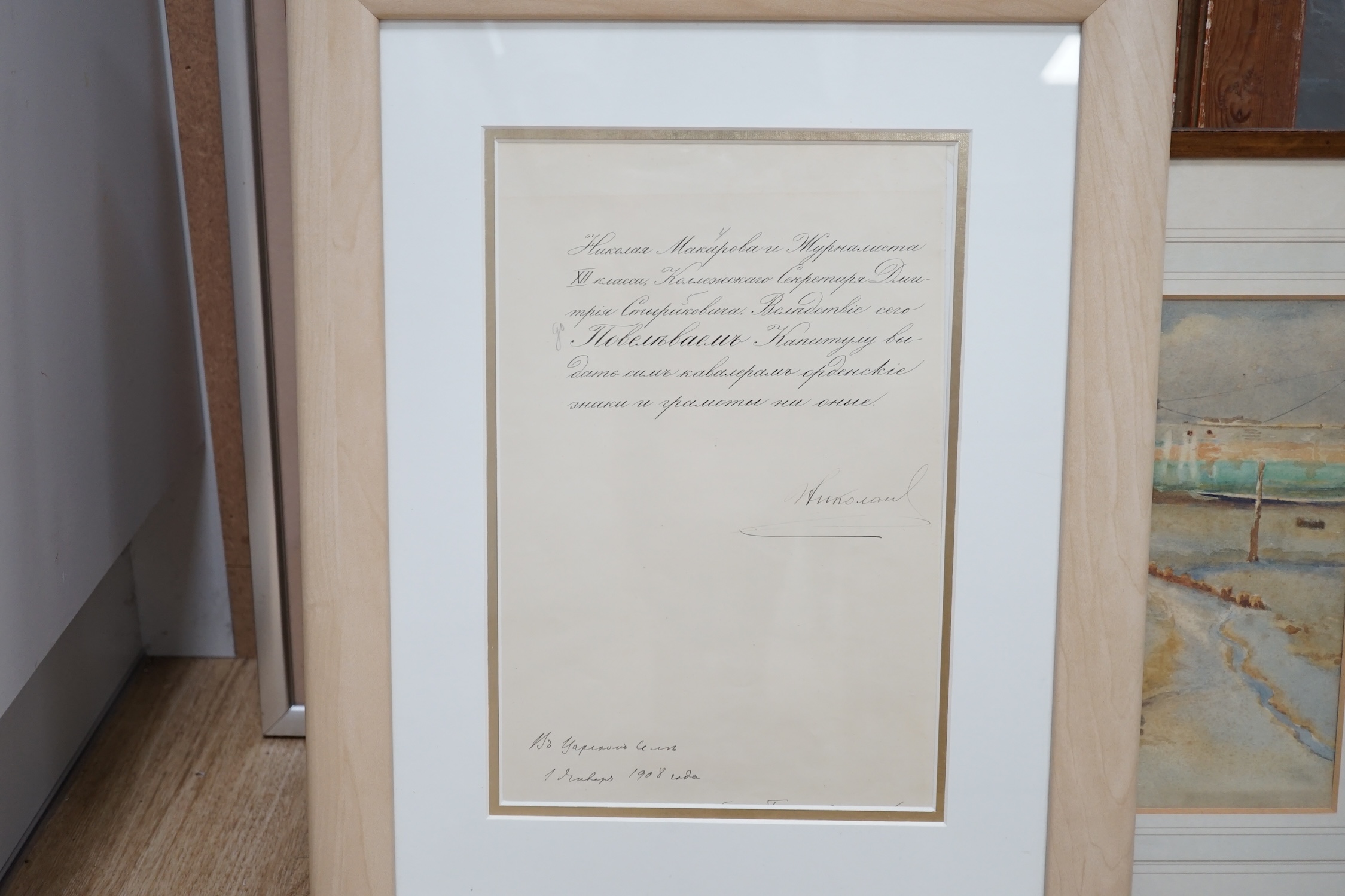 Tsar Nicholas II (1868-1918) interest, a four page hand written and signed document, dated 1908, granting several awards, (only first page showing in frame), leaf 29.5 x 19.5cm